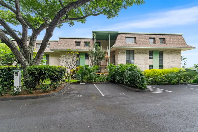 front view of a house with a garden