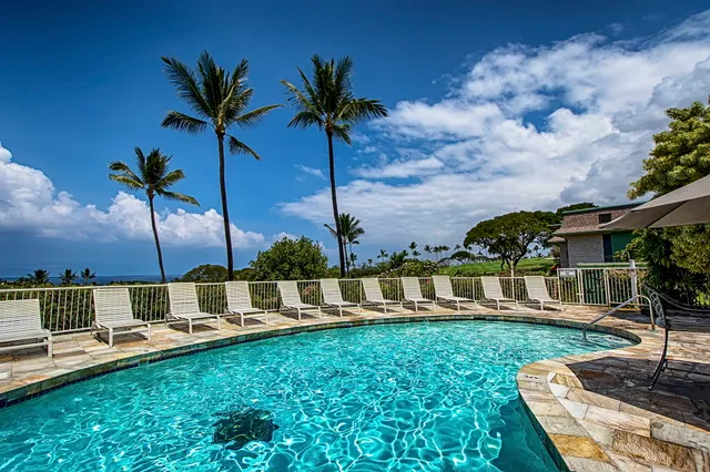 a view of swimming pool with a table and chairs