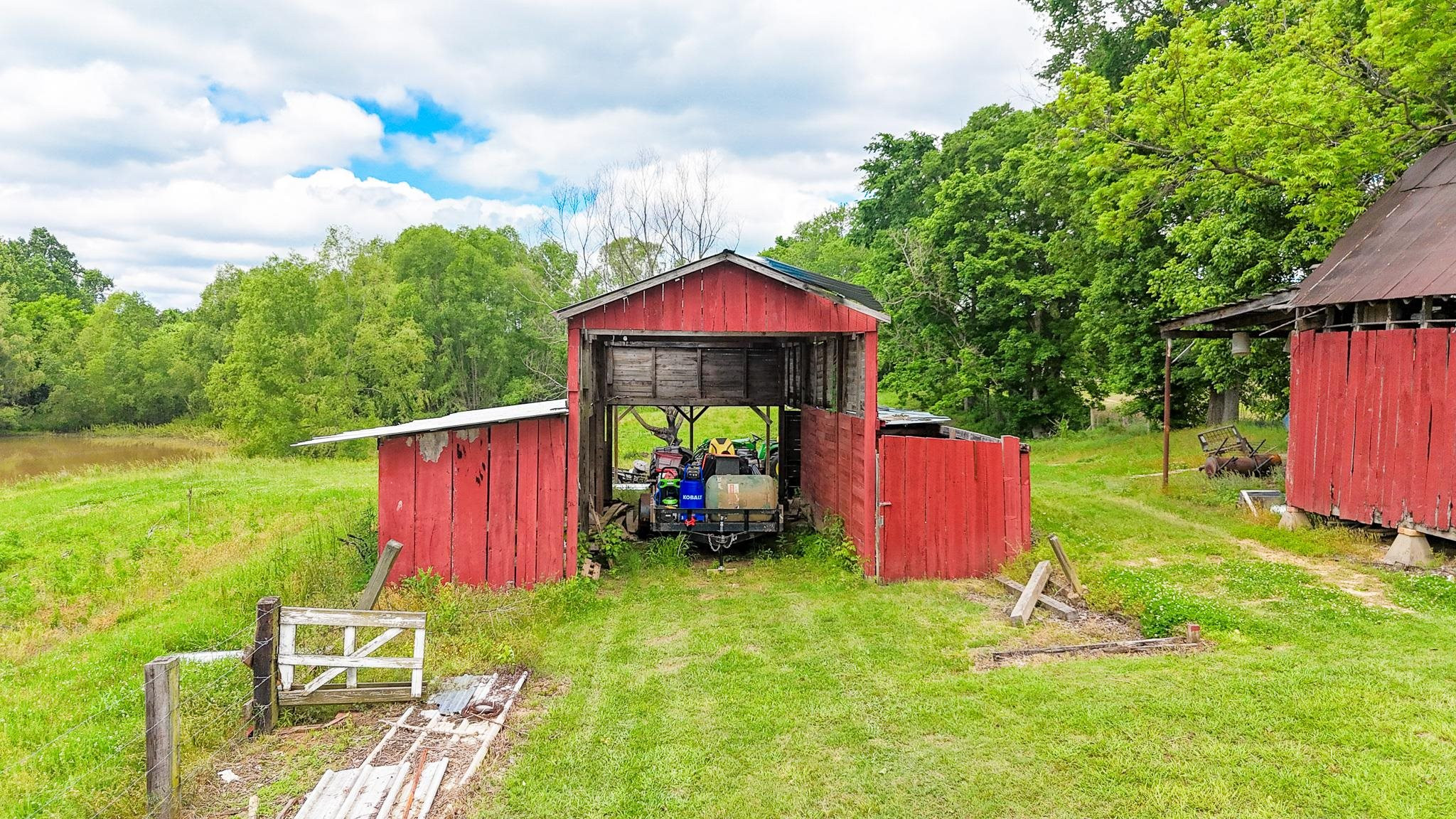 2390 Dr Lewis Road Ripley, TN 38063 - Photo 13 of 48 a backyard of a house with table and chairs