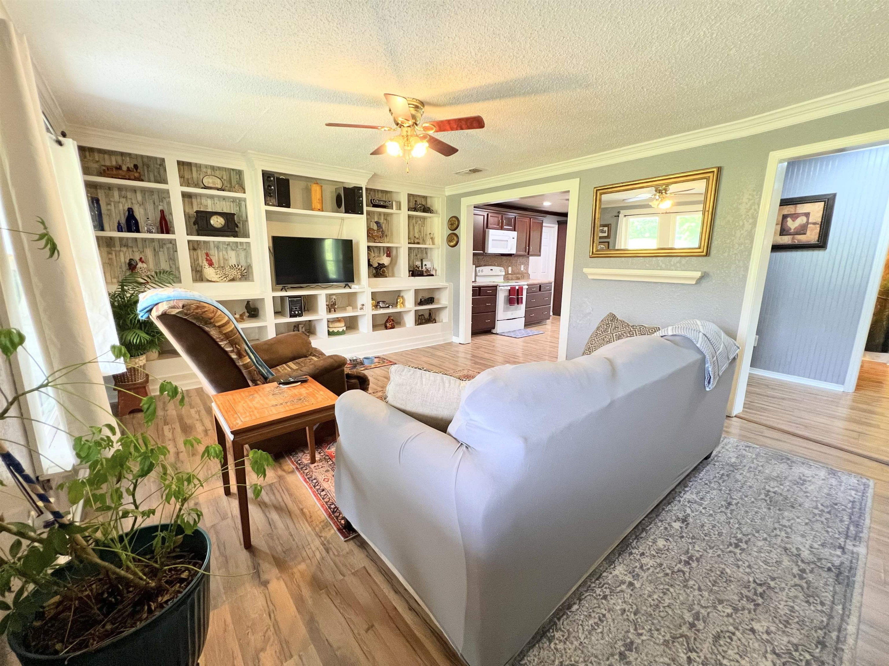 2390 Dr Lewis Road Ripley, TN 38063 - Photo 16 of 48 a living room with furniture and a large window