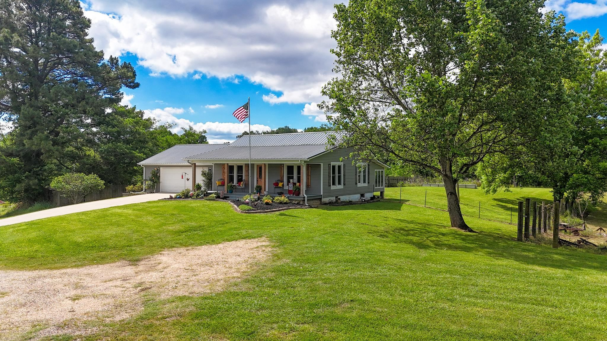 2390 Dr Lewis Road Ripley, TN 38063 - Photo 2 of 48 a front view of a house with garden