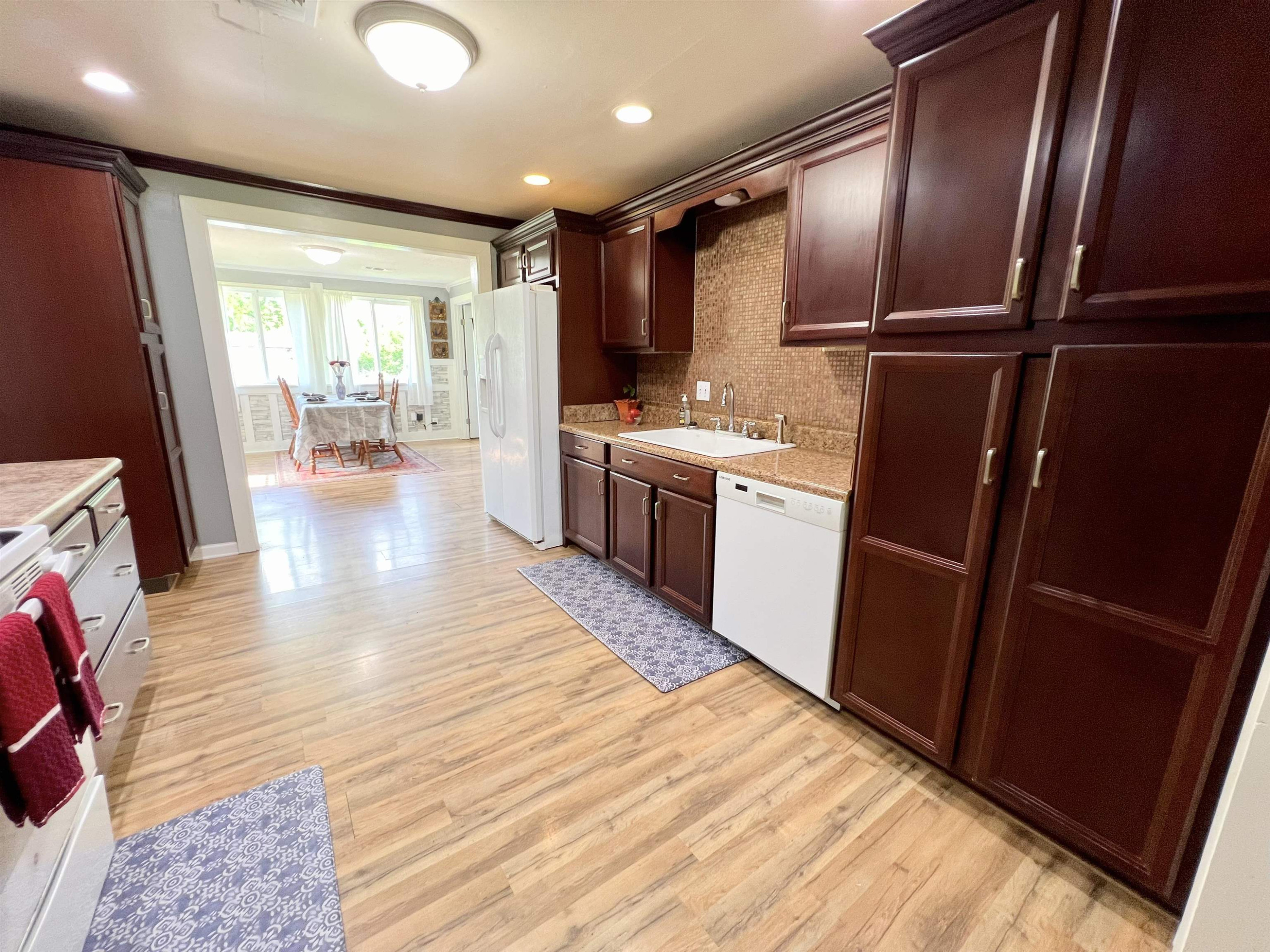 2390 Dr Lewis Road Ripley, TN 38063 - Photo 22 of 48 a kitchen with stainless steel appliances granite countertop a refrigerator stove and sink