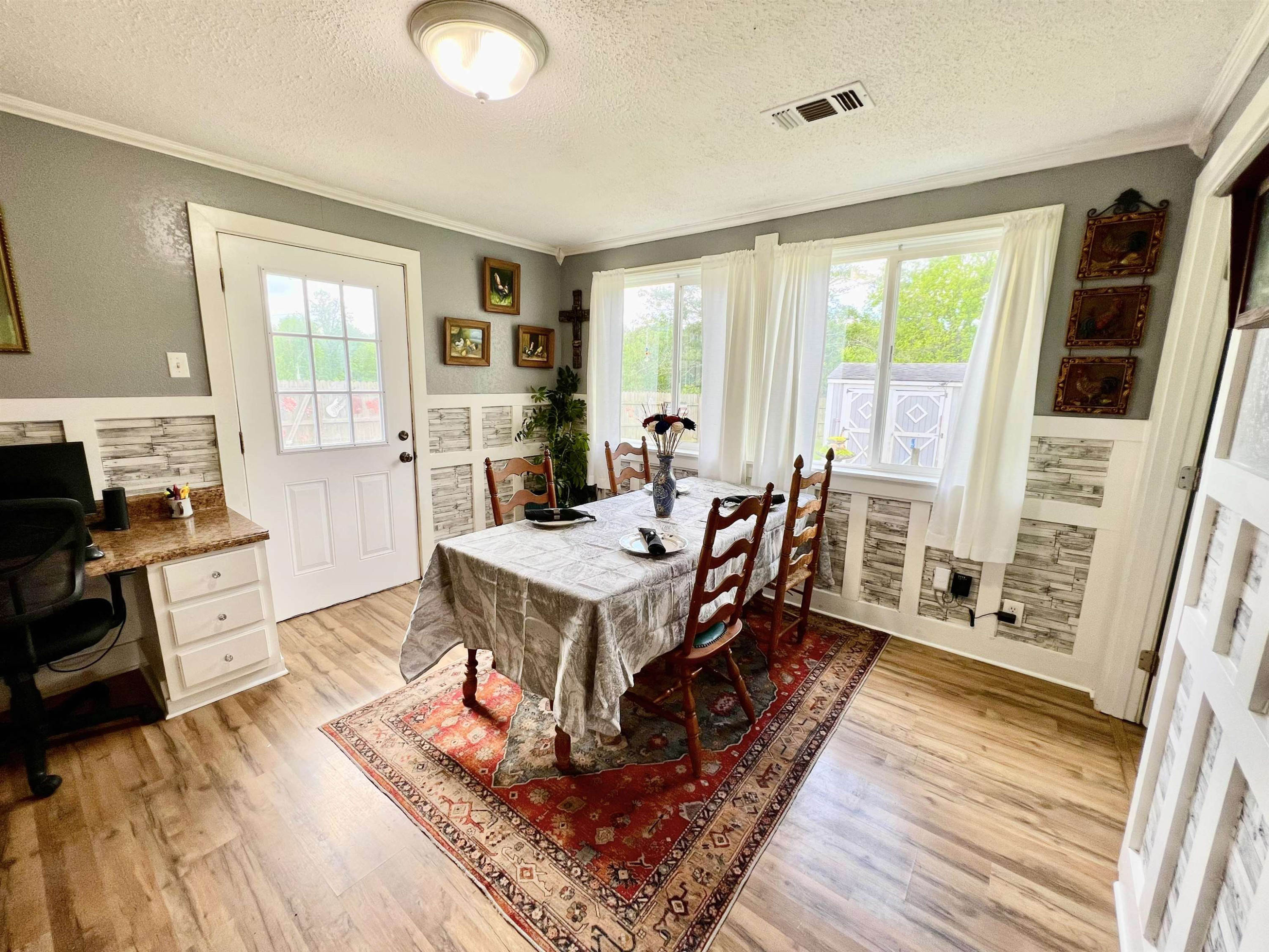 2390 Dr Lewis Road Ripley, TN 38063 - Photo 25 of 48 a living room with furniture a large window wooden floor and a rug