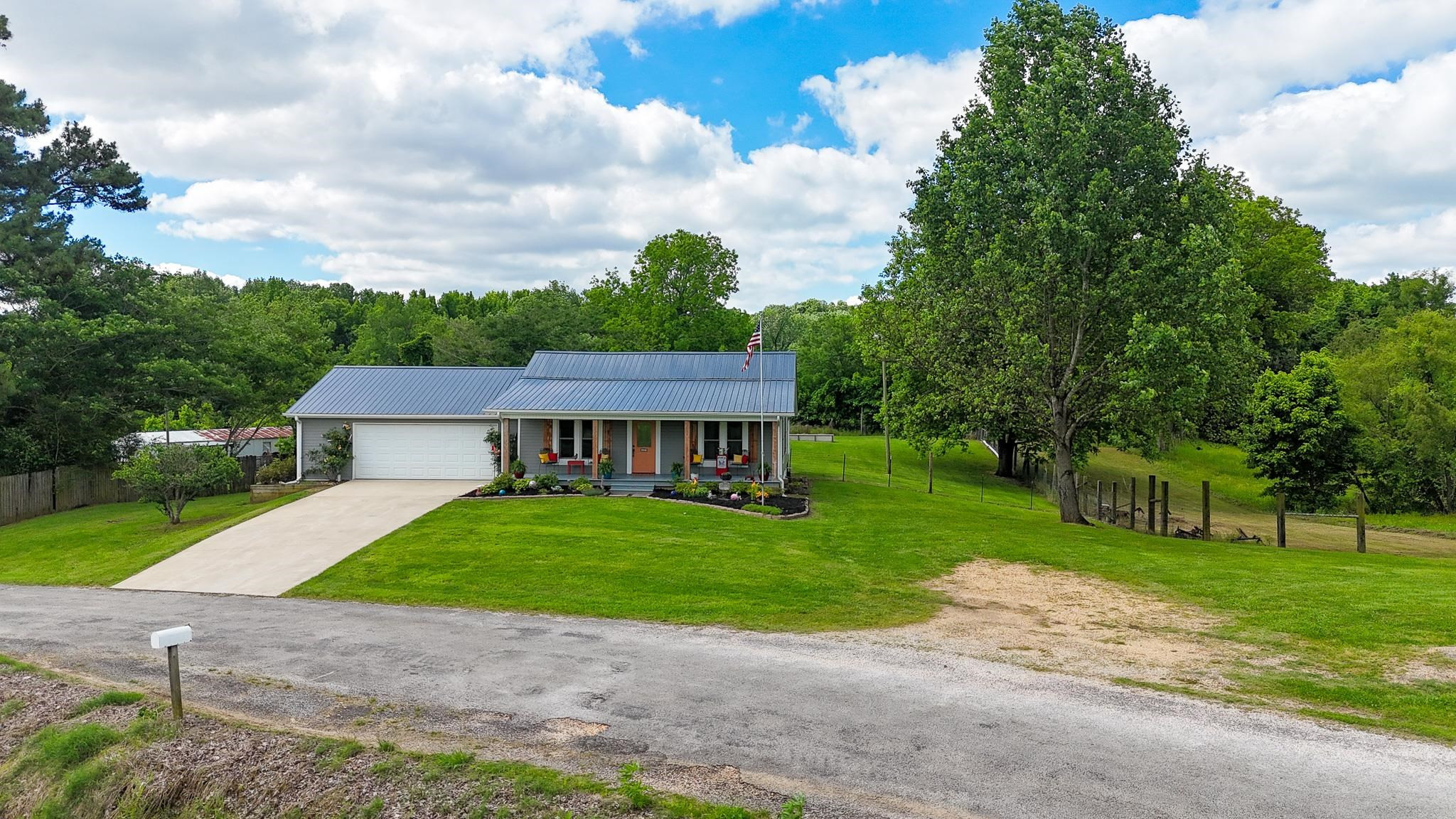 2390 Dr Lewis Road Ripley, TN 38063 - Photo 3 of 48 a view of a house with a big yard plants and trees