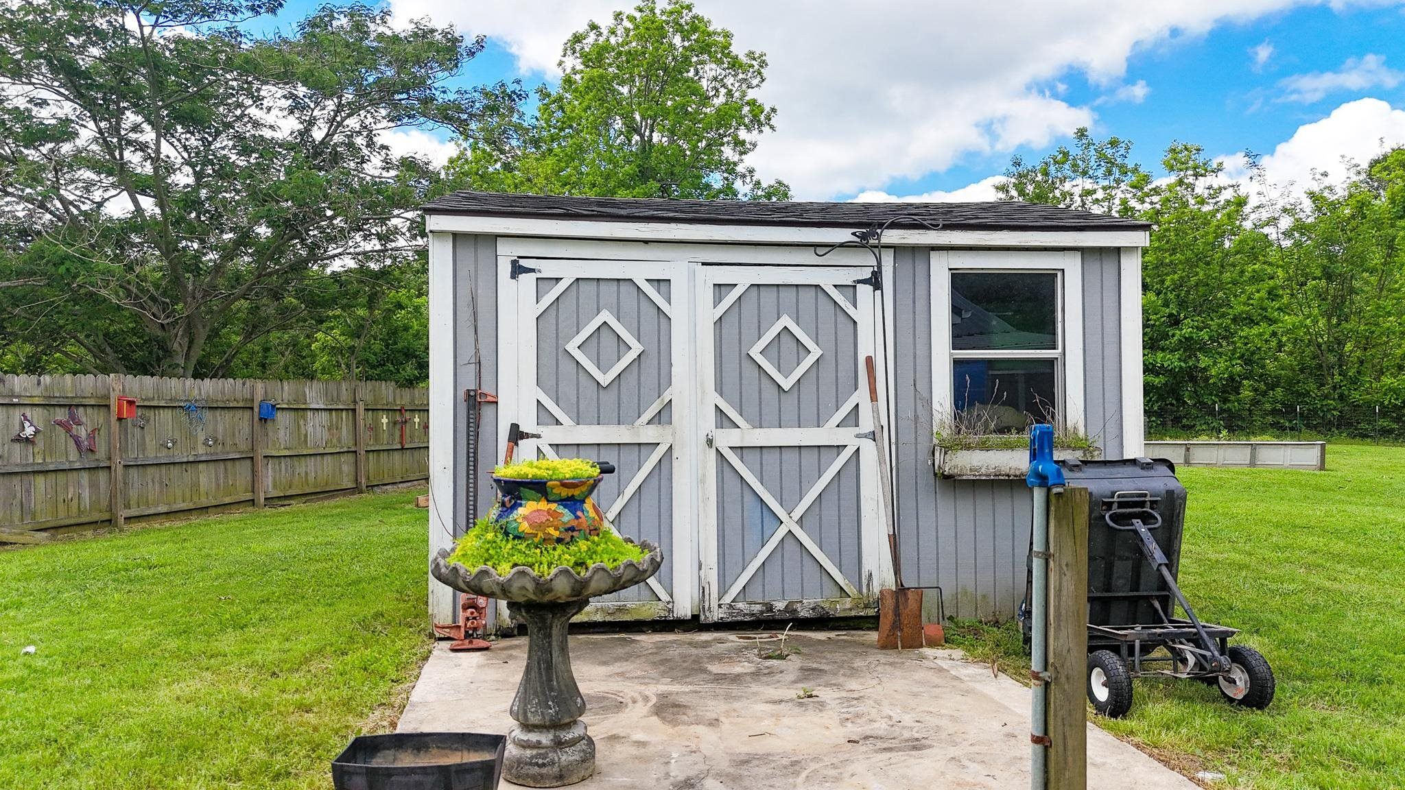 2390 Dr Lewis Road Ripley, TN 38063 - Photo 41 of 48 a front view of a house having garden
