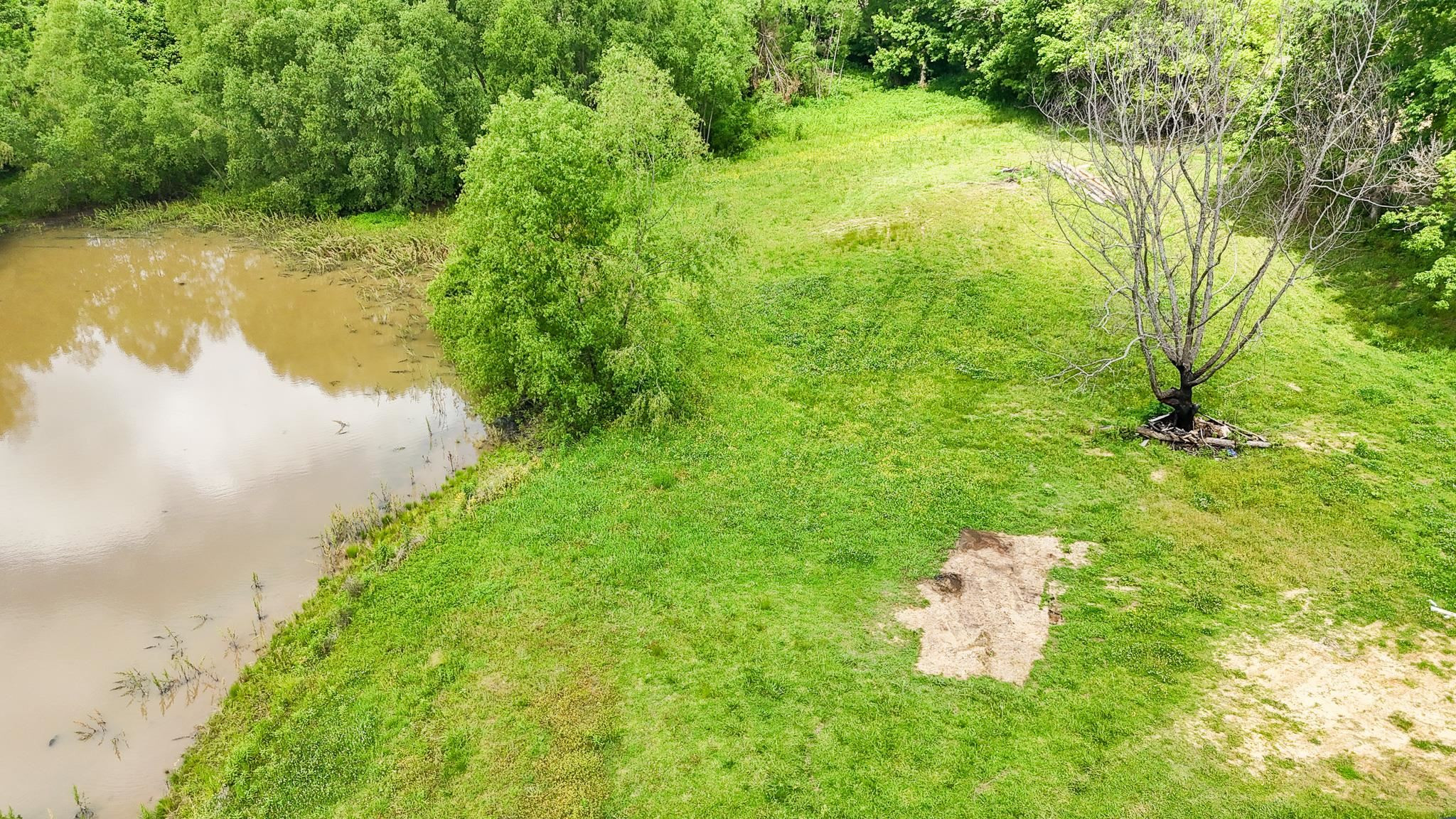 2390 Dr Lewis Road Ripley, TN 38063 - Photo 47 of 48 a view of a lake with a yard