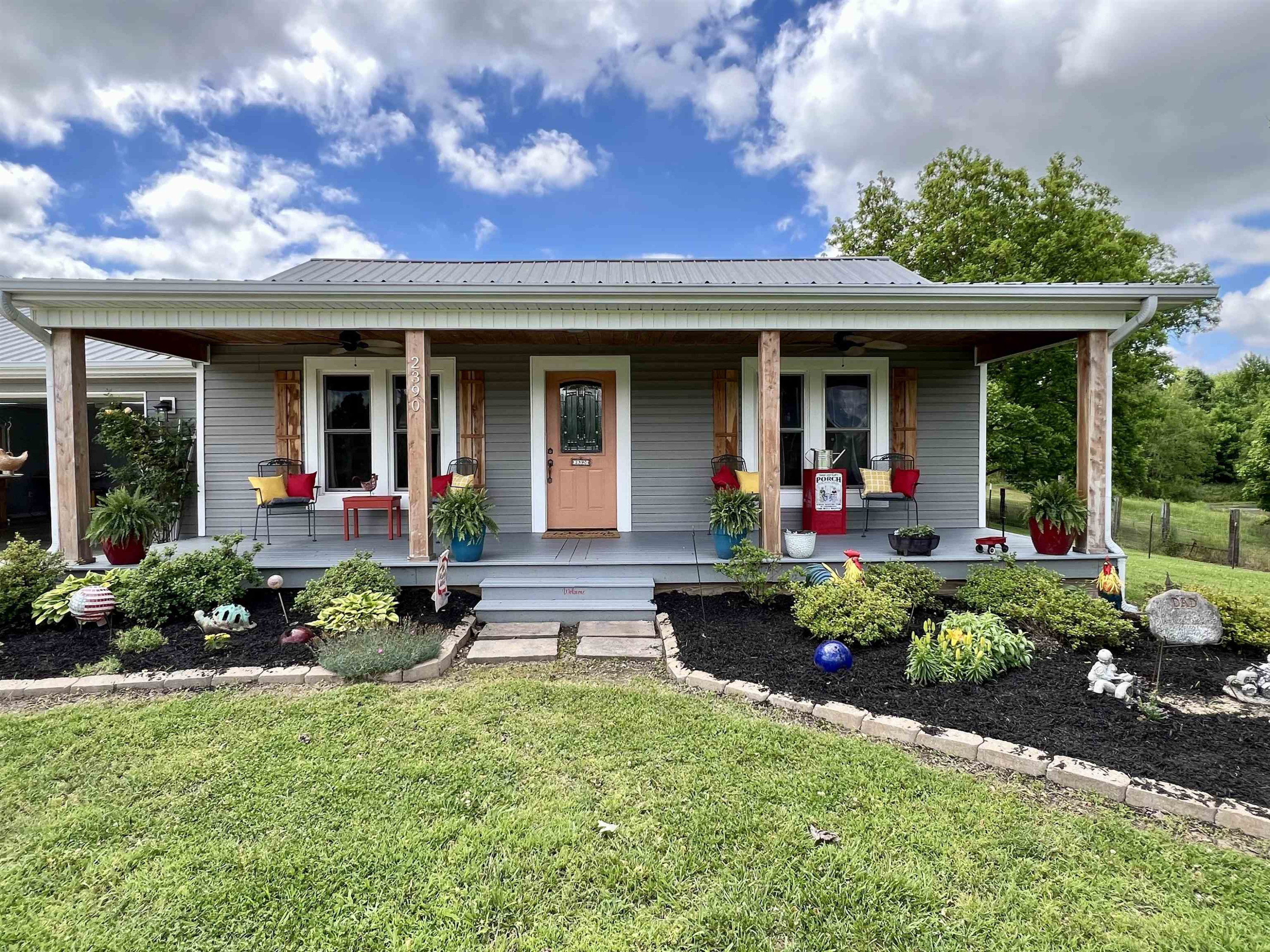 2390 Dr Lewis Road Ripley, TN 38063 - Photo 6 of 48 a view of a house with sitting area and garden