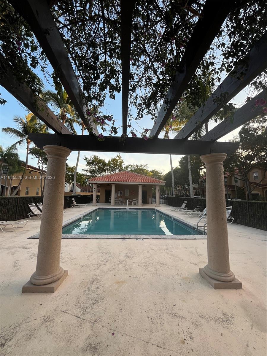 10872 Southwest 89th Street, Unit 10872 Miami, FL 33176 - Photo 22 of 25 a view of backyard with green space