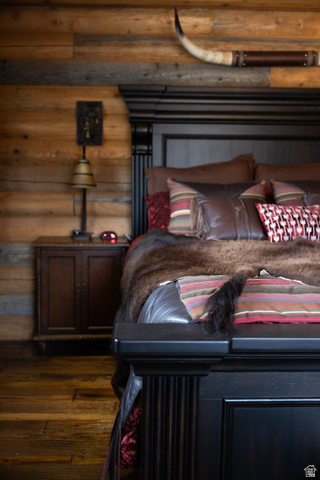 18906 North Canyon Road Whiterocks, UT 84085 - Photo 23 of 65 Bedroom with log walls and dark wood-style flooring