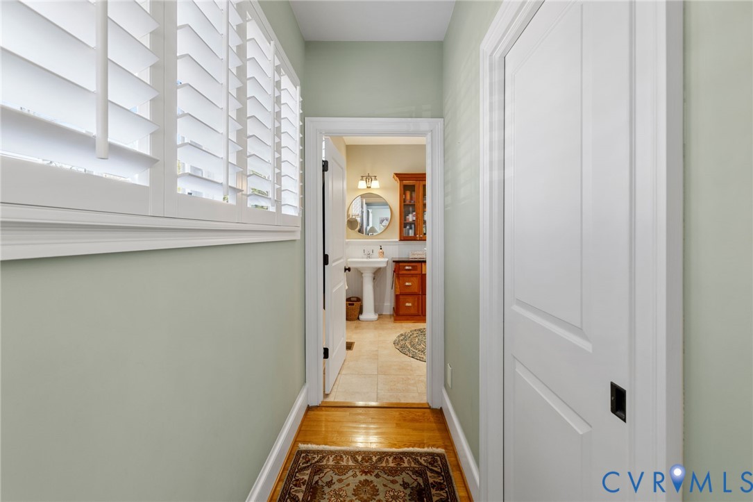 8947 Cherokee Road Richmond, VA 23235 - Photo 28 of 45 a view of a hallway view with wooden floor and staircase