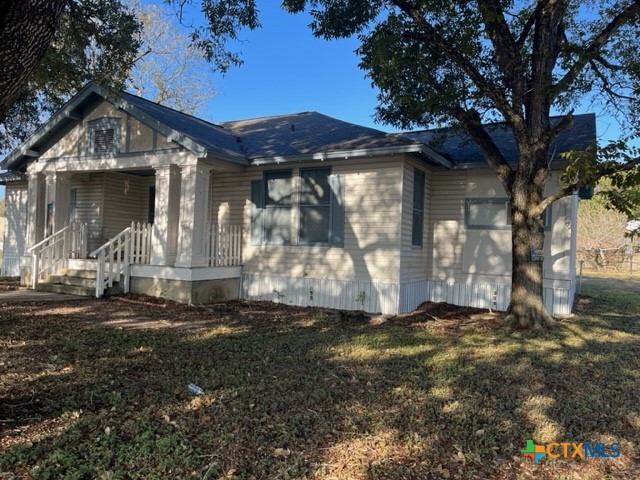 904 Edgar Street Yoakum, TX 77995 - Photo 2 of 10 a front view of a house with a yard