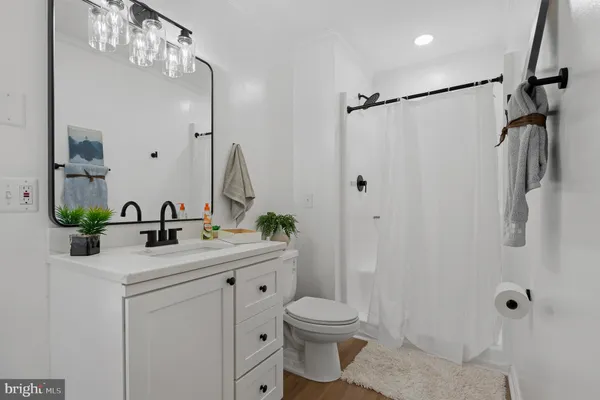 a bathroom with a double vanity sink mirror and
