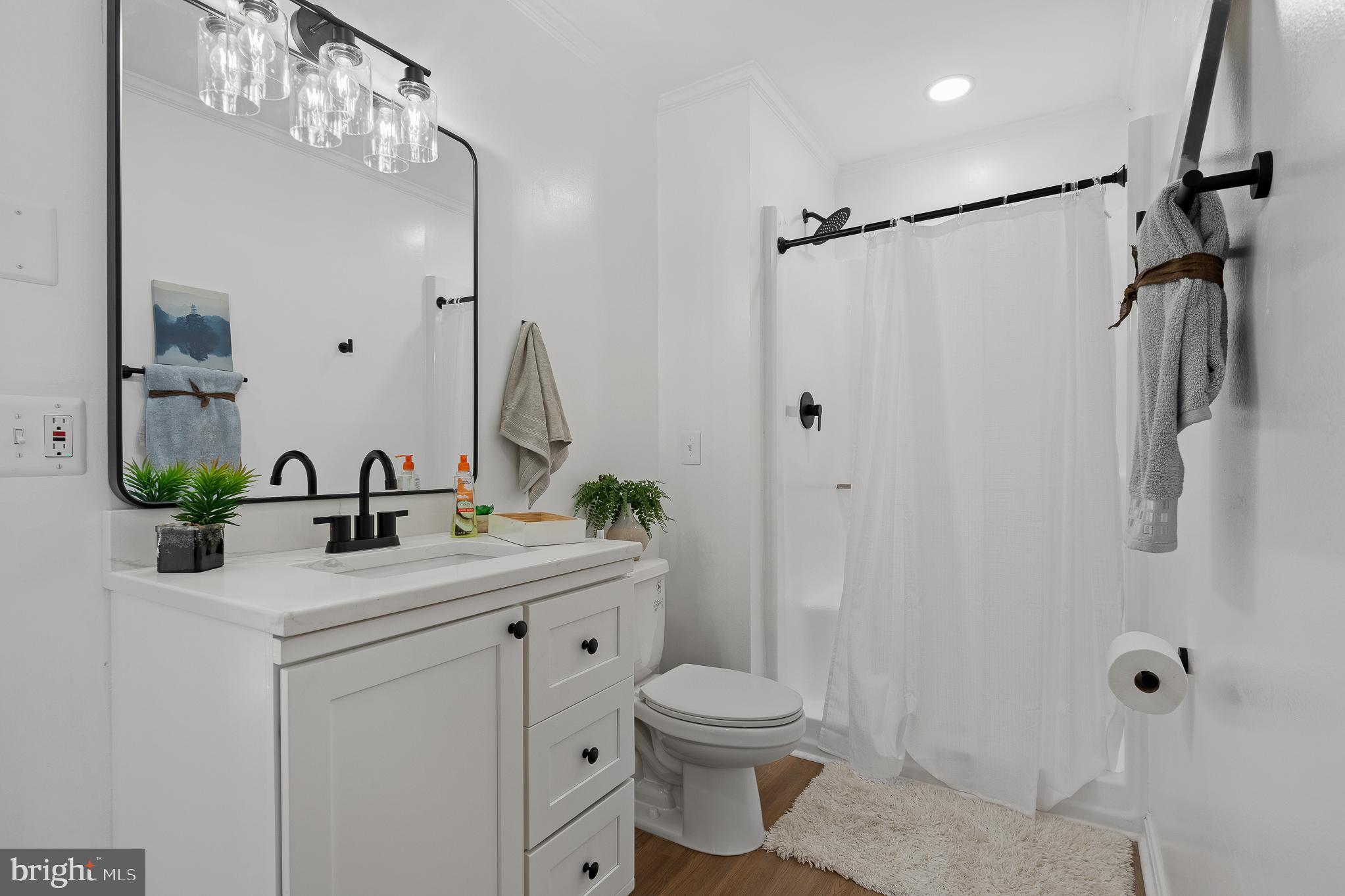 5235 Chalk Point Road West River, MD 20778 - Photo 34 of 69 a bathroom with a sink a toilet and shower