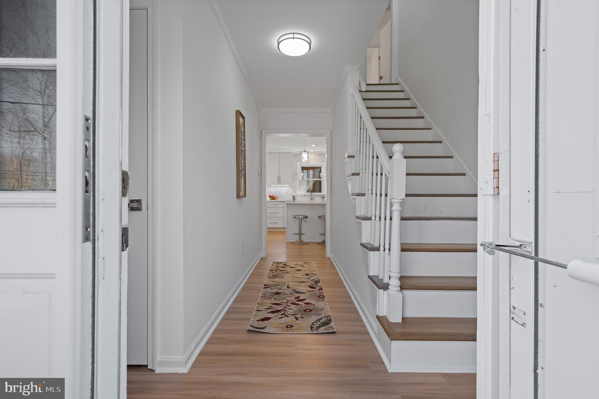 5235 Chalk Point Road West River, MD 20778 - Photo 36 of 69 a view of a hallway with wooden floor and stairs