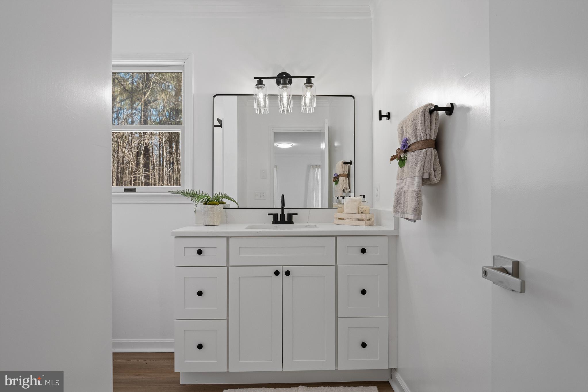5235 Chalk Point Road West River, MD 20778 - Photo 43 of 69 a bathroom with a double vanity sink mirror and