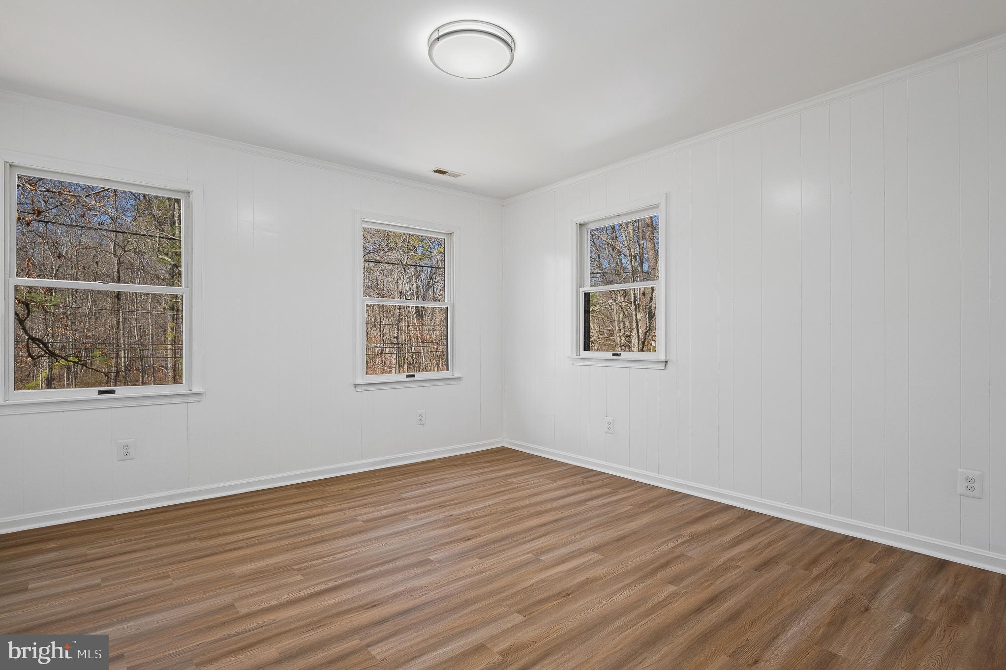 5235 Chalk Point Road West River, MD 20778 - Photo 50 of 69 a view of empty room with wooden floor and fan