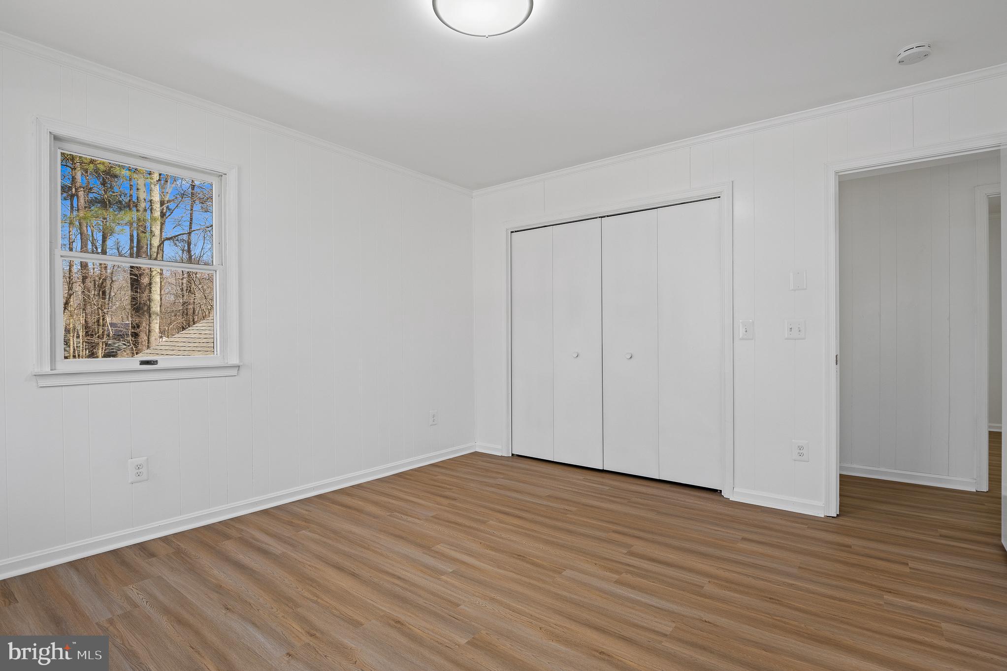 5235 Chalk Point Road West River, MD 20778 - Photo 51 of 69 a view of empty room with wooden floor and fan
