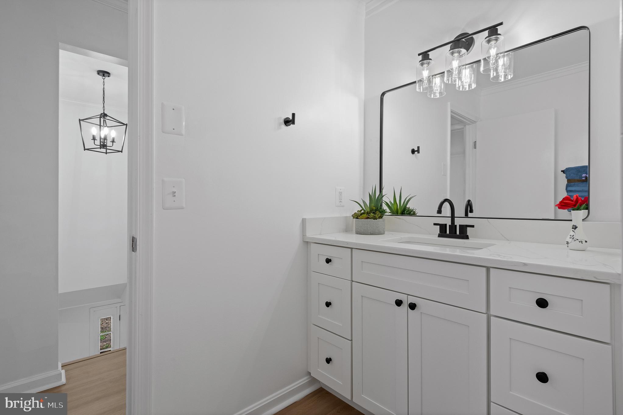 5235 Chalk Point Road West River, MD 20778 - Photo 54 of 69 a bathroom with a double vanity sink and a mirror
