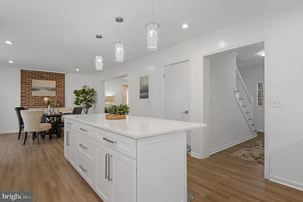 a kitchen with stainless steel appliances a refrigerator sink and microwave