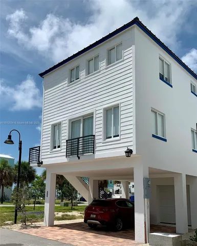 a view of a car park in front of house