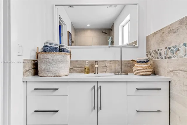 a kitchen with cabinets and window