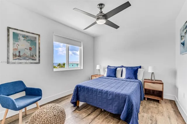 a bedroom with a bed and a couch