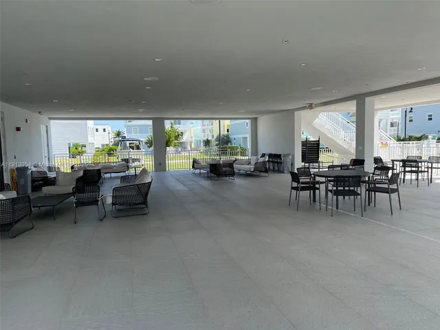 a view of a lake with a table and chairs