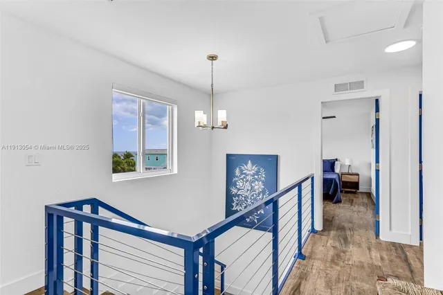 a view of a livingroom with furniture and stairs