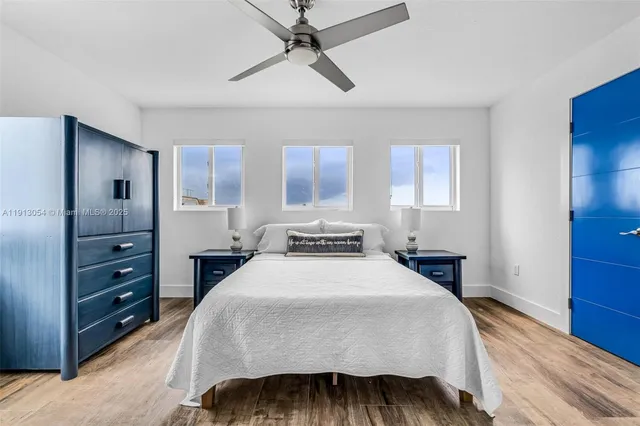 a bedroom with a large bed and a dresser