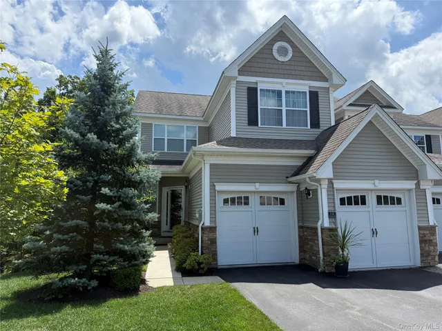 a view of house with a yard