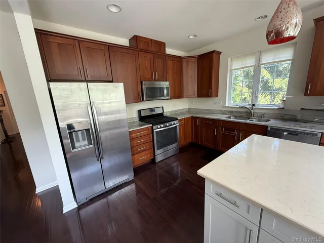 a view of a chair and table in the balcony