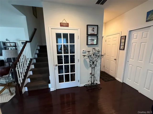 a view of a dining room with furniture and window