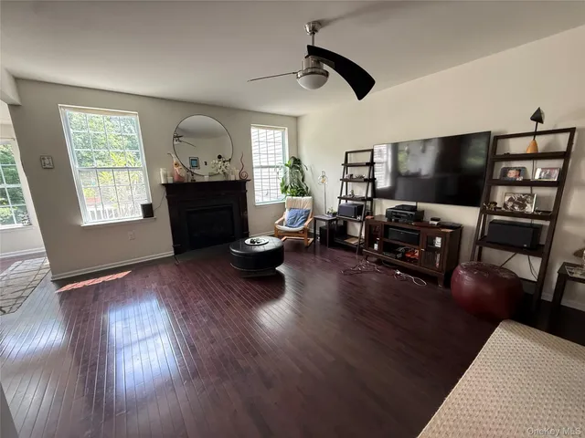 a kitchen with granite countertop wooden cabinets and white appliances