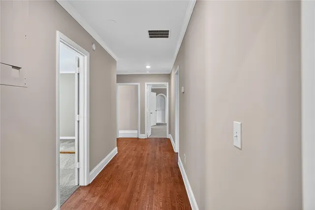a spacious bathroom with a double vanity sink and a mirror