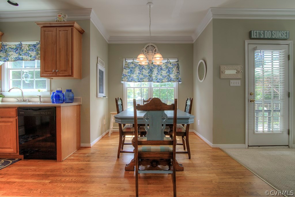 707 Biggin Pond Road Midlothian, VA 23114 - Photo 11 of 36 a view of a dining room with furniture and chandelier