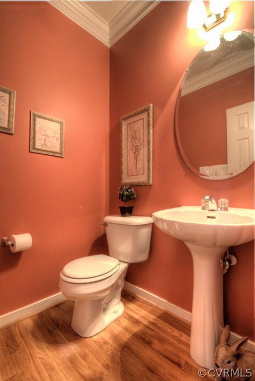 707 Biggin Pond Road Midlothian, VA 23114 - Photo 16 of 36 a bathroom with a toilet sink and mirror
