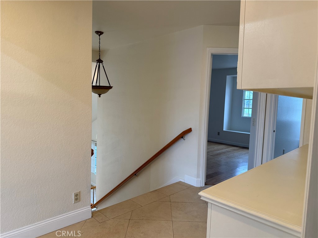 2421 Mangular Avenue Corona, CA 92882 - Photo 14 of 25 a view of a hallway view with wooden floor and staircase