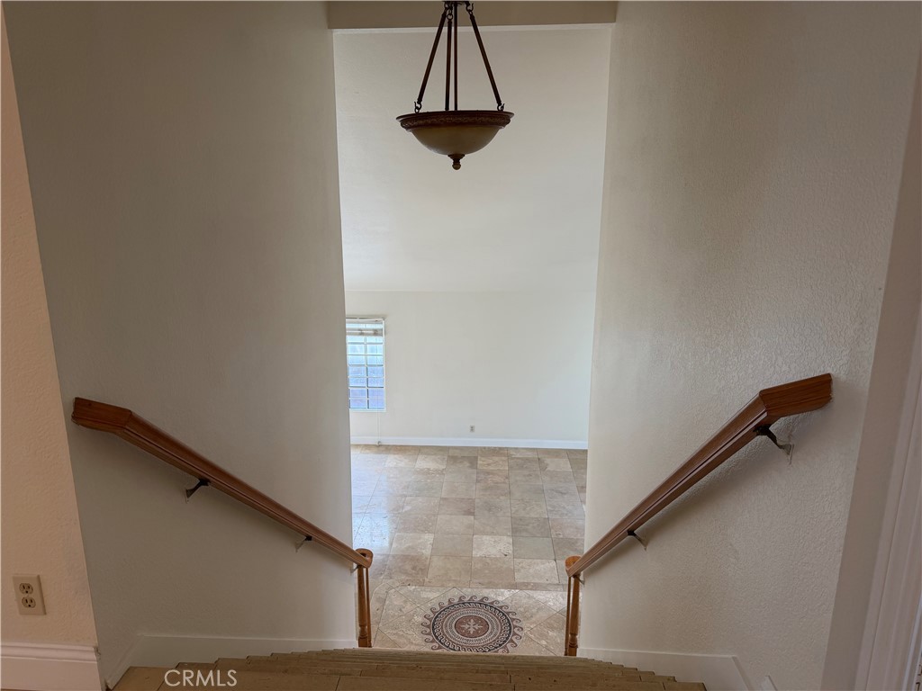 2421 Mangular Avenue Corona, CA 92882 - Photo 15 of 25 Upstair look down to family room