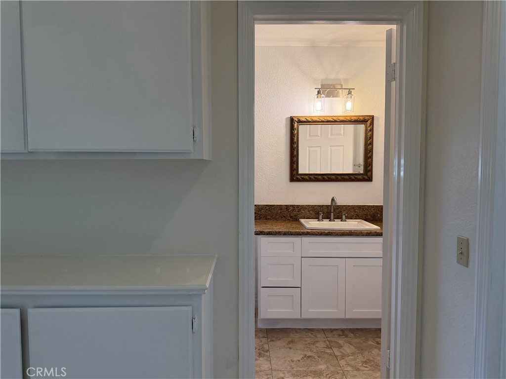 2421 Mangular Avenue Corona, CA 92882 - Photo 17 of 25 Bathroom 2 upstair w/built in cabinet at hall