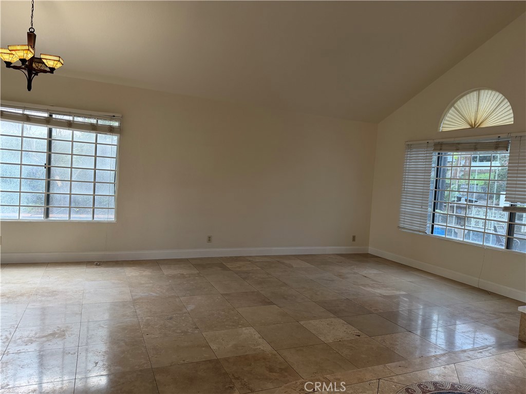 2421 Mangular Avenue Corona, CA 92882 - Photo 2 of 25 a view of an empty room with a window