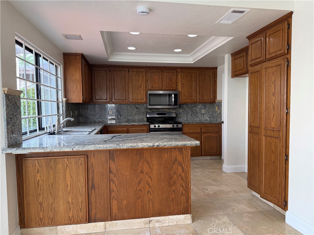 2421 Mangular Avenue Corona, CA 92882 - Photo 3 of 25 Kitchen with granite counter top