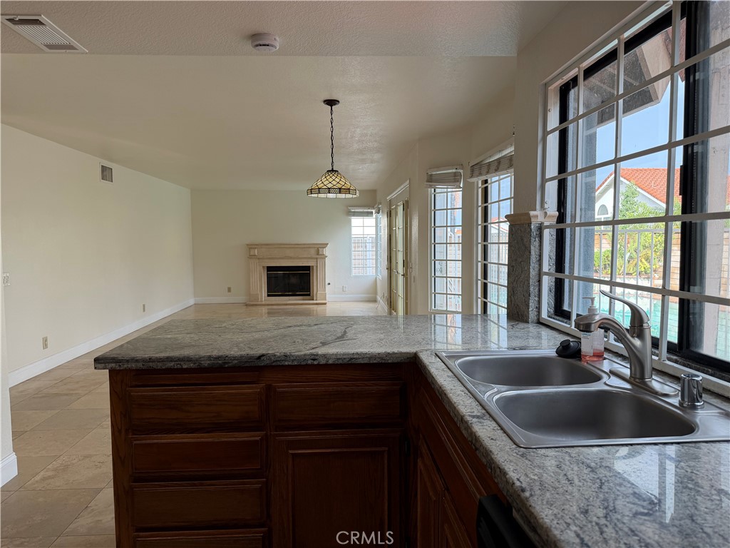 2421 Mangular Avenue Corona, CA 92882 - Photo 4 of 25 Kitchen-Dining area-Living room