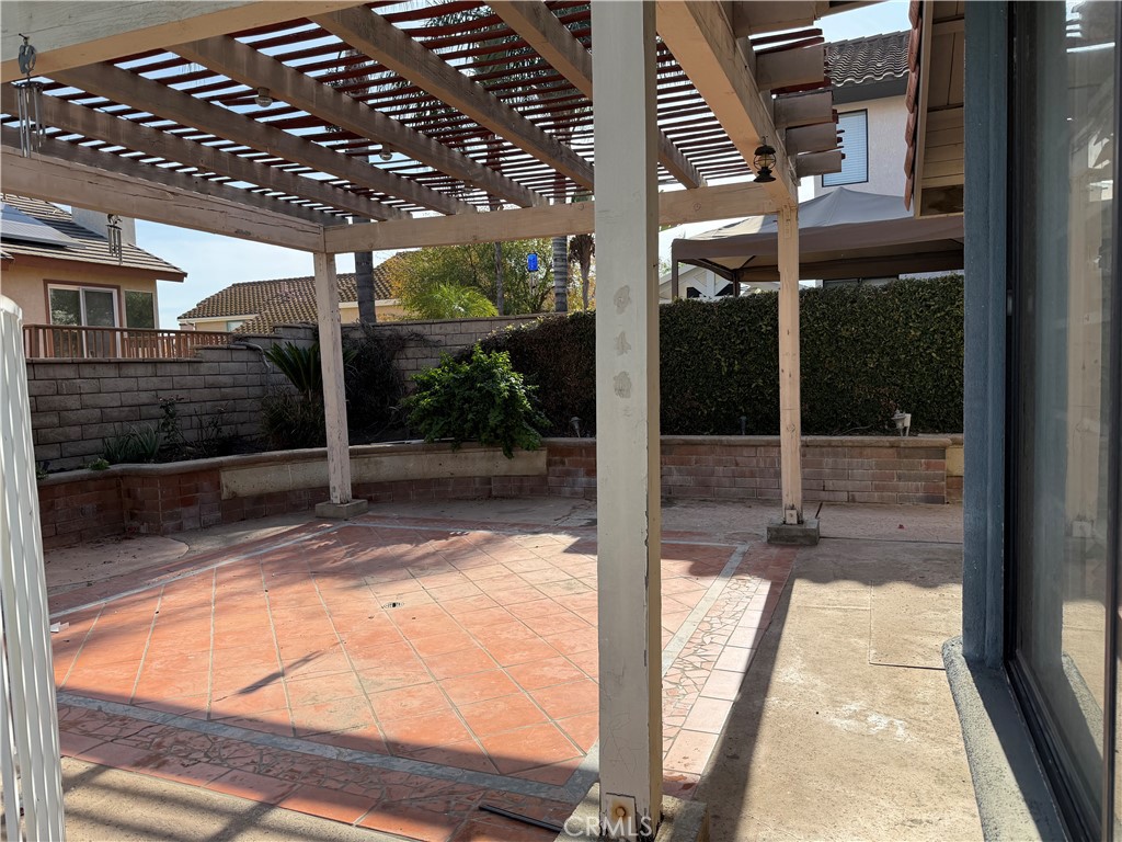 2421 Mangular Avenue Corona, CA 92882 - Photo 9 of 25 a view of swimming pool with a tree in front of it