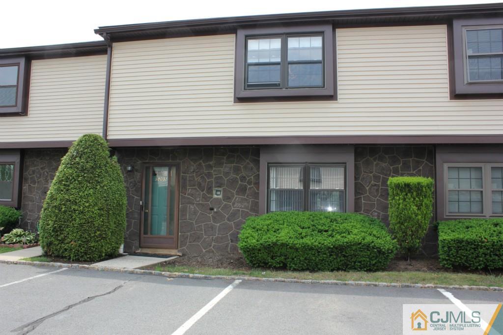 5205 Hana Road Edison, NJ 08817 - Photo 1 of 15 a front view of a house with garden