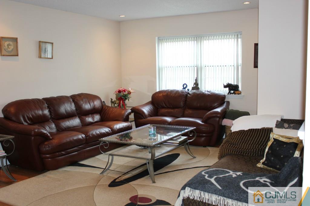 5205 Hana Road Edison, NJ 08817 - Photo 2 of 15 a living room with furniture and a window