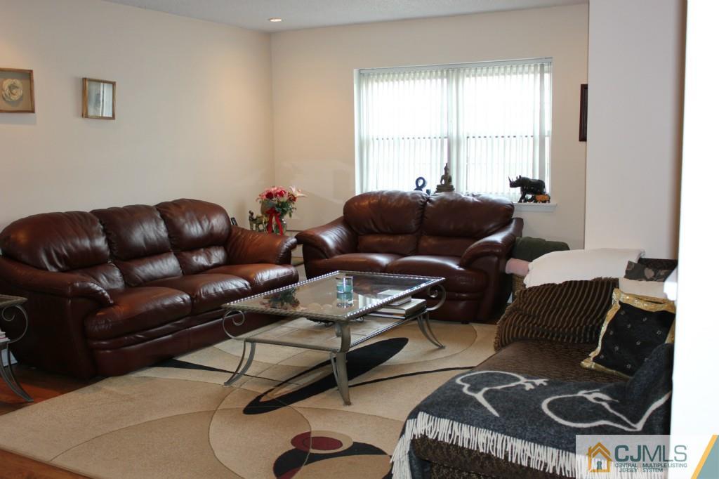 5205 Hana Road Edison, NJ 08817 - Photo 3 of 15 a living room with furniture and a window