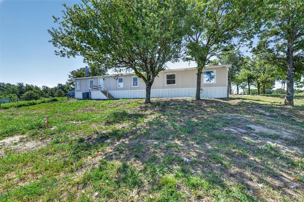 449 Big Salty Lane Springtown, TX 76082 - Photo 24 of 25 Back of the home and trees