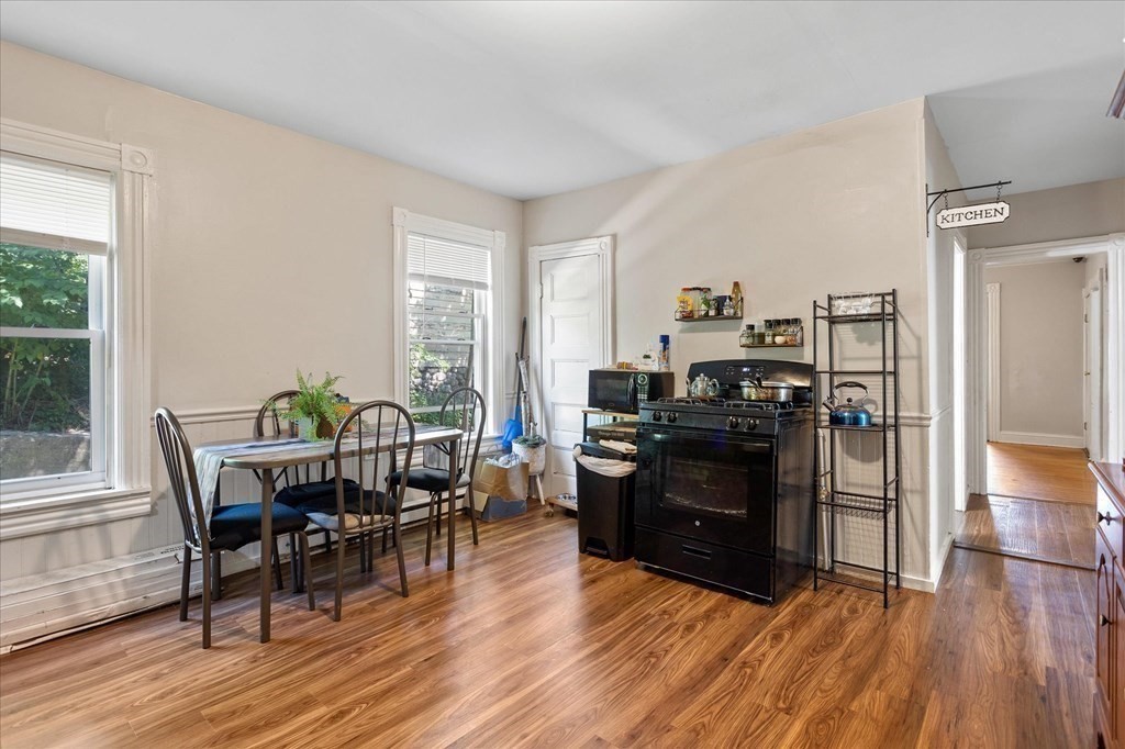 1550-1552 Main Street Worcester, MA 01603 - Photo 16 of 34 a view of a dining room with furniture and wooden floor