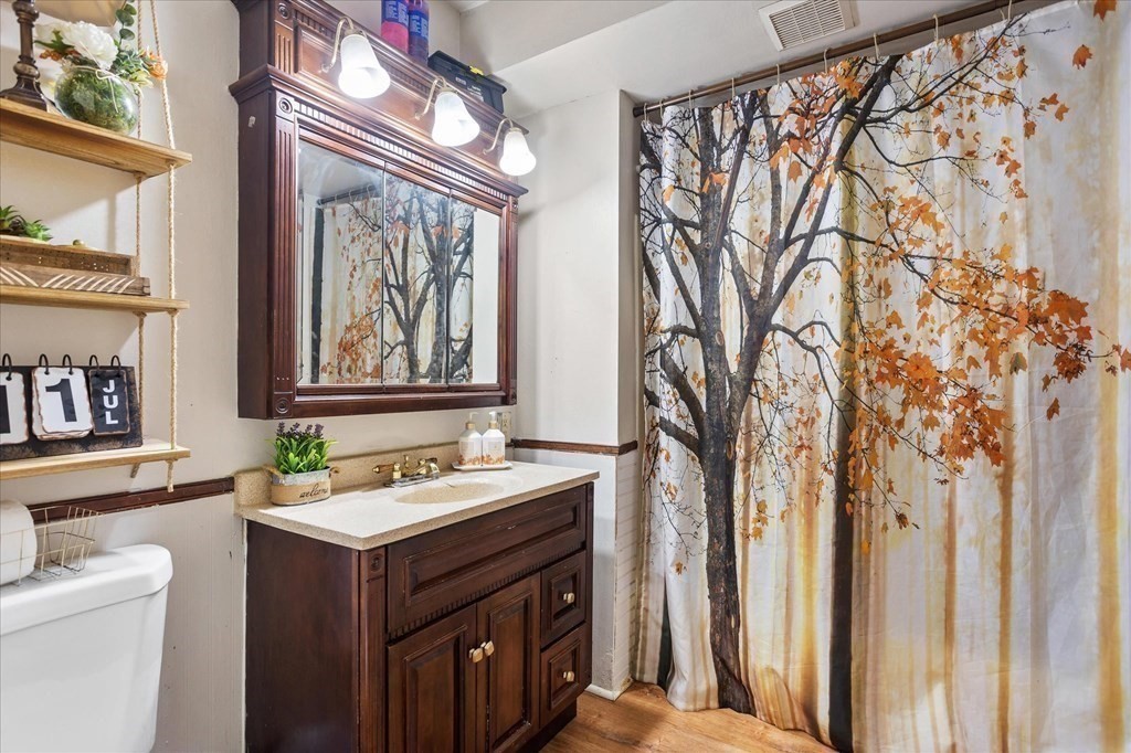 1550-1552 Main Street Worcester, MA 01603 - Photo 19 of 34 a bathroom with a sink and a mirror