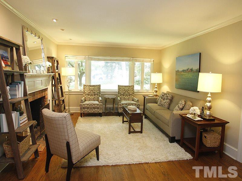 1307 Duplin Road Raleigh, NC 27607 - Photo 2 of 19 a living room with fireplace furniture and a large window